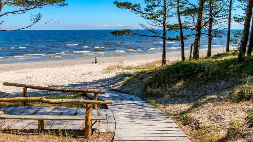 wooden pathway going to the beach- latvia digital nomad visa