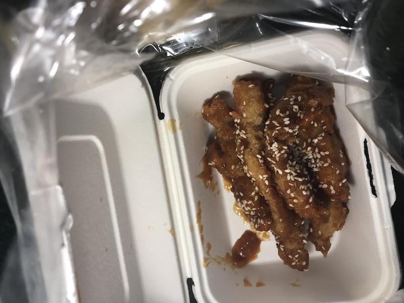 image of korean chicken - thai street food inside of a styrofoam
