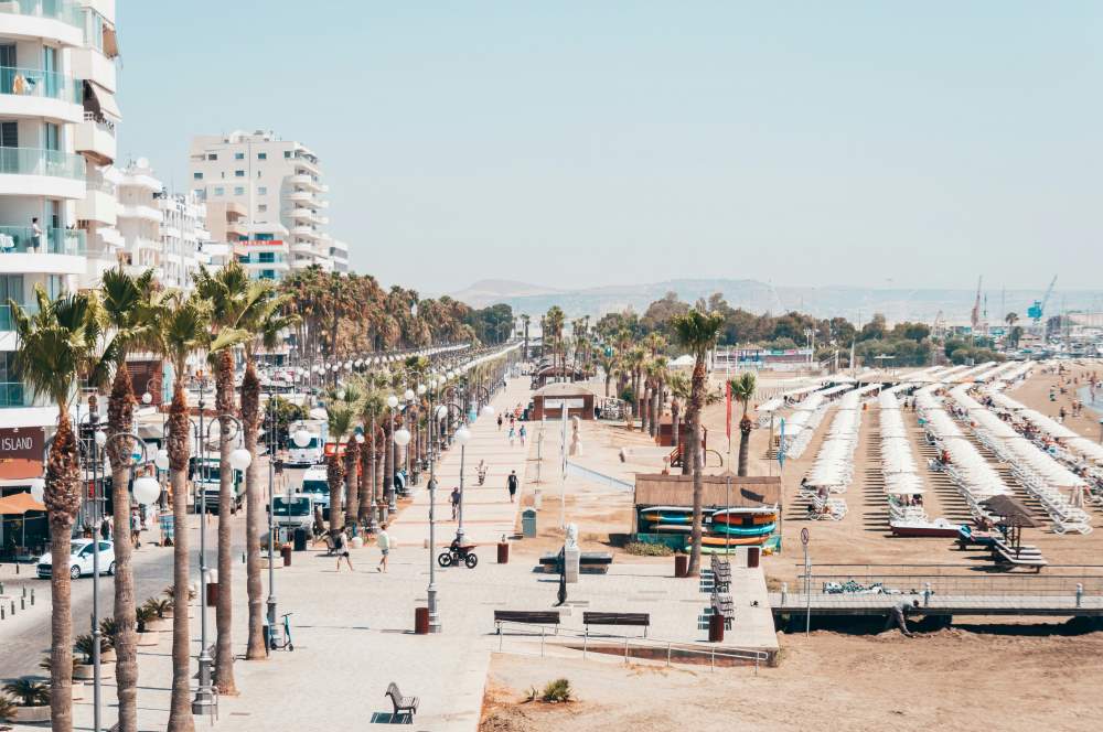 aerial view of city with people walking in the street near the beach- cyprus digital nomad visa