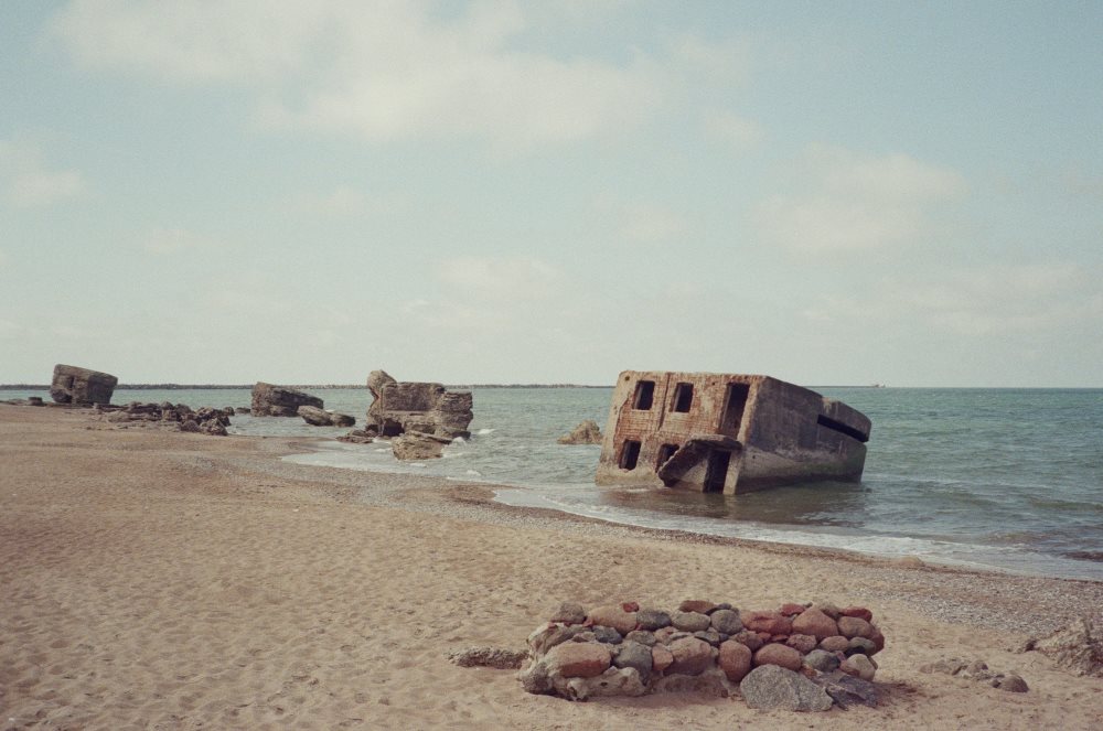stone ruins formation in the ocean near the seashore- latvia digital nomad visa