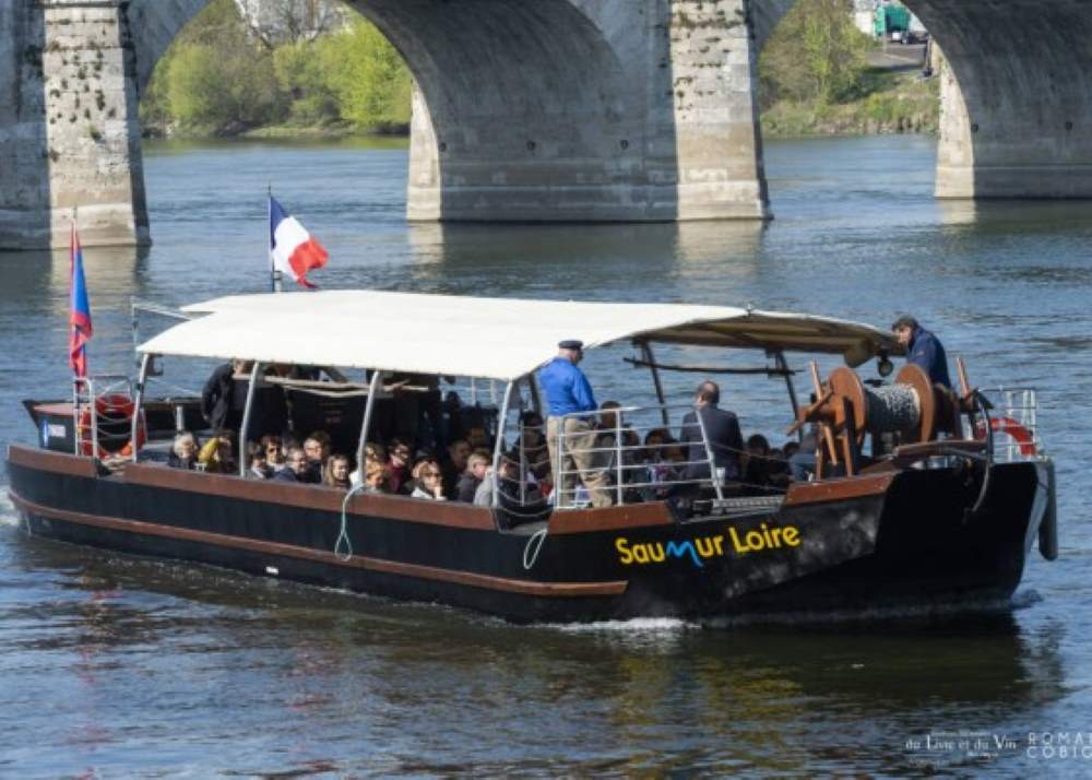group of people inside boat sailing in the Loire Valley
