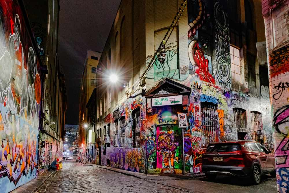 car park in front of building full of street arts - Best Places to Visit in Australia
