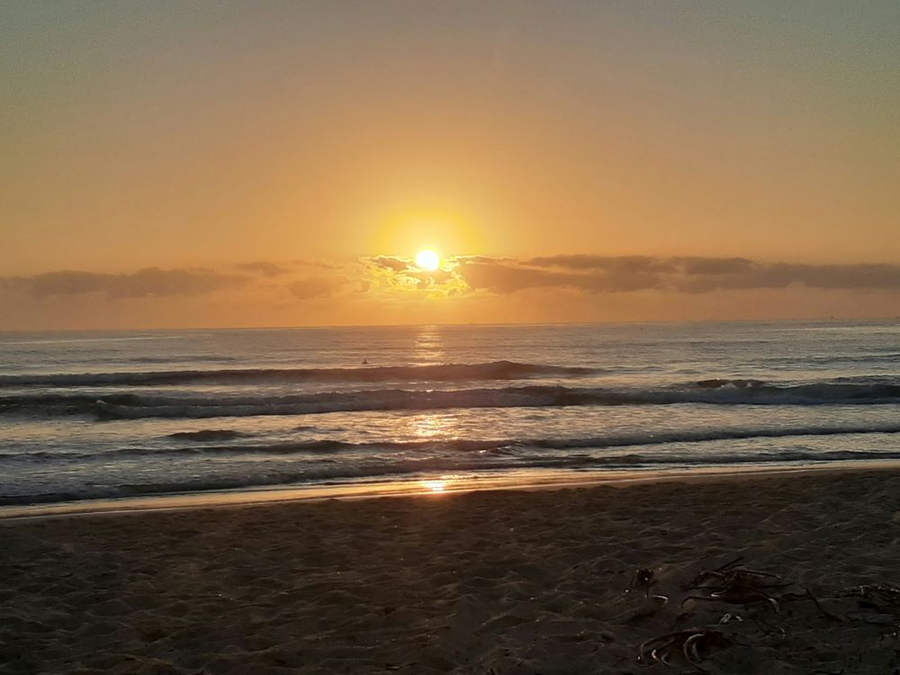 sun setting over the calm sea