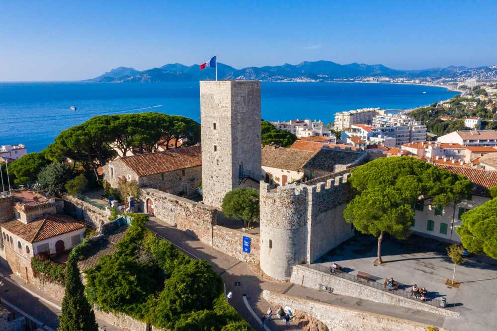 aerial view of the old brick building known as the  Musée de la Castre near the ocean