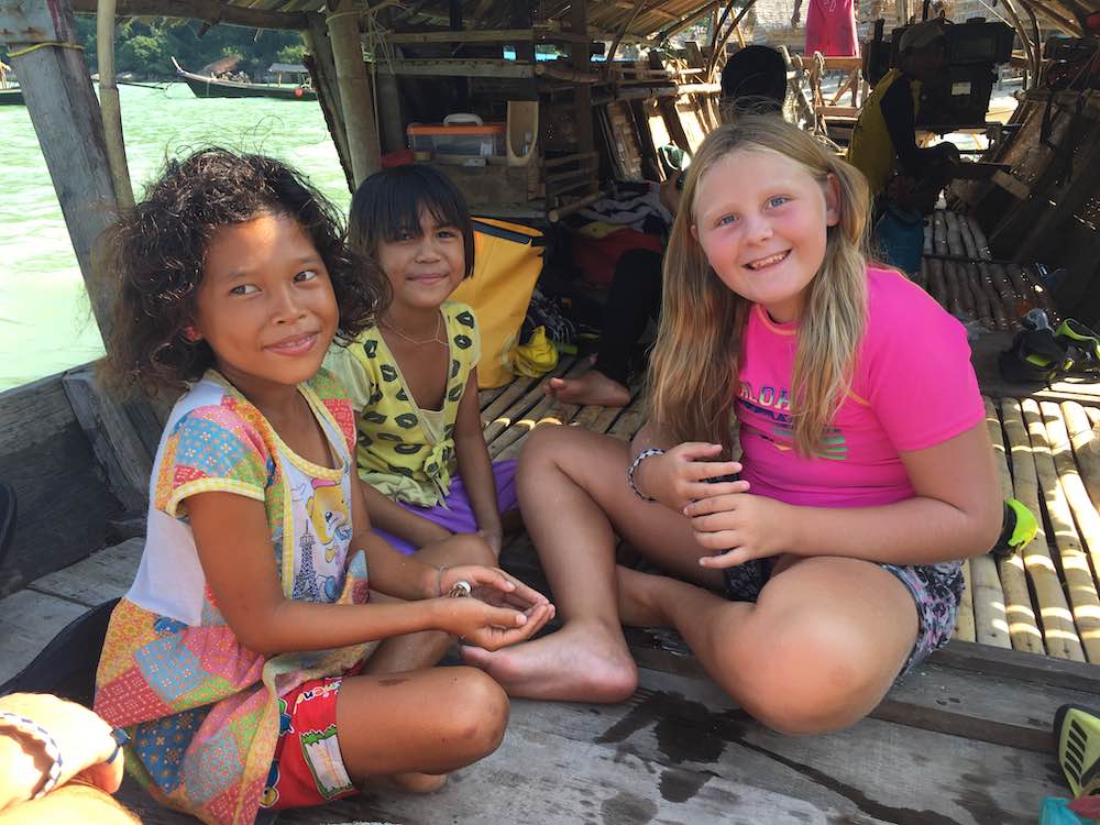 My daughter connecting with the local kids in The Surin Islands, Thailand