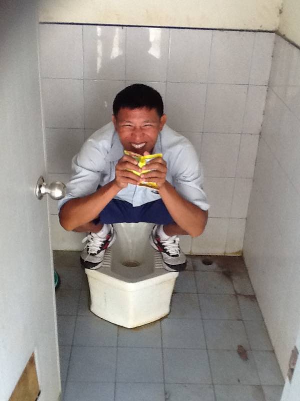 My Thai friend Jit showing me how to use the local toilets!