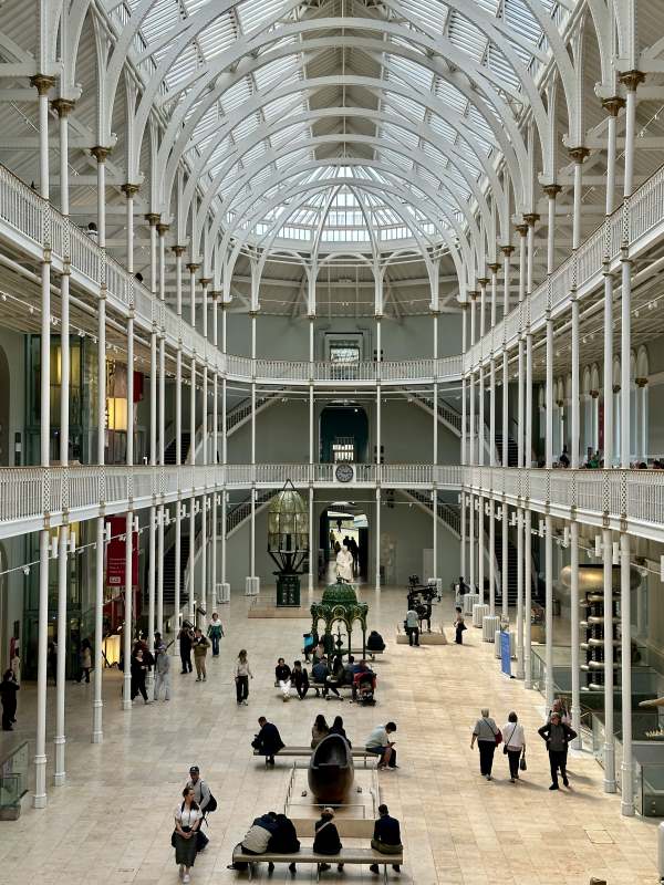 people inside museum high ceiling with white interior