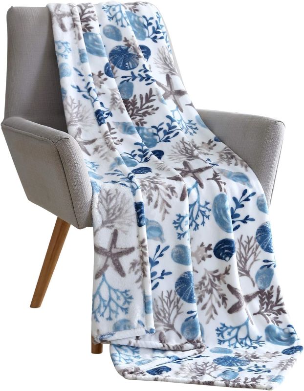 ocean design blanket on top of a chair