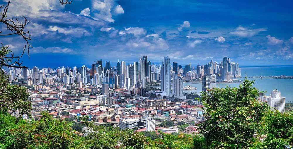 Aerial view of a city with tall buildings and near the beach