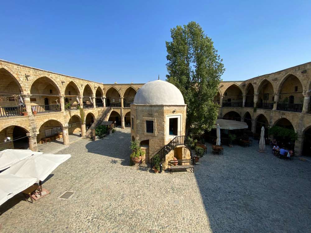 dome building in the middle of a open structure beside a green tree- cyprus digital nomad visa