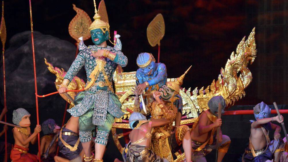 people wearing mask and costume perfoming