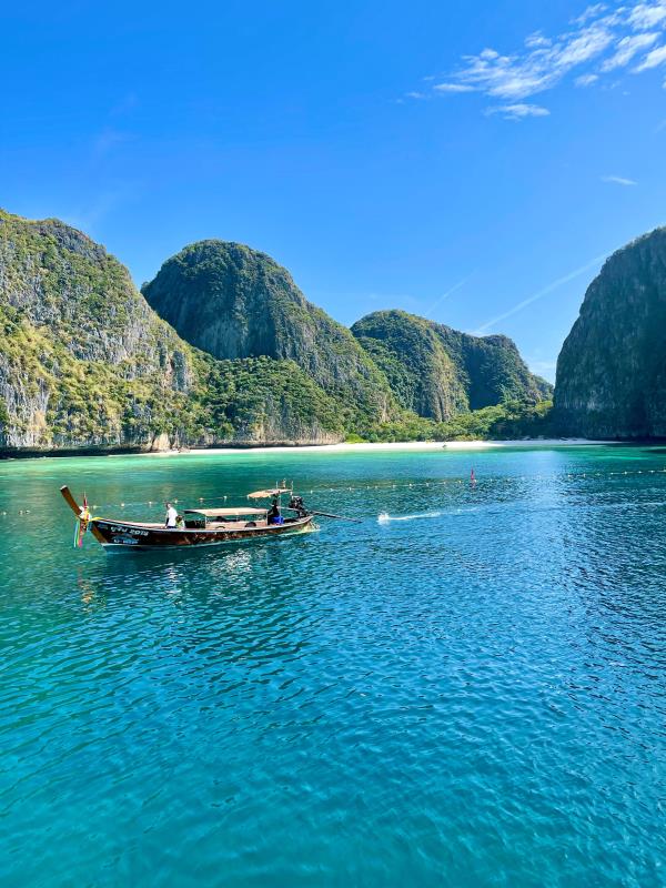 boat sailing in a green ocean
