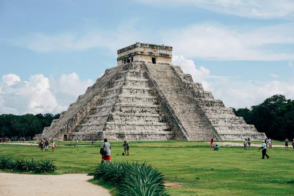 people walking nearby huge pyramid