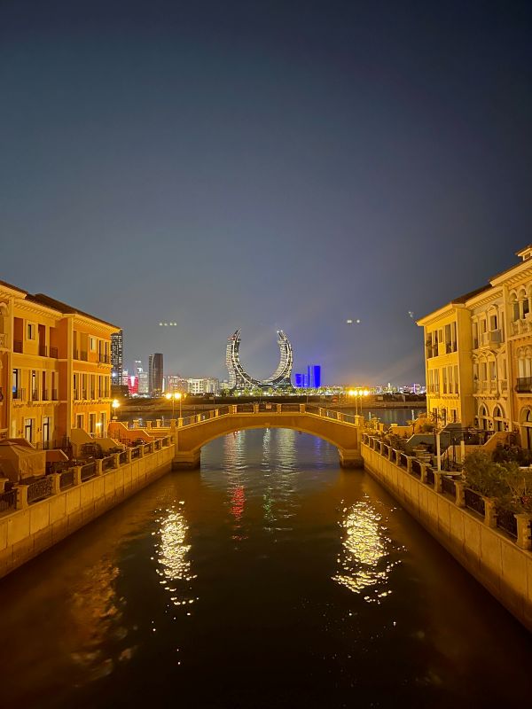Venetian-inspired canals showing a building in the background - One Day in Doha