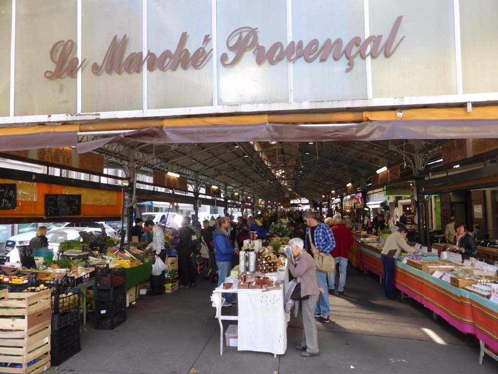 people looking around an open market