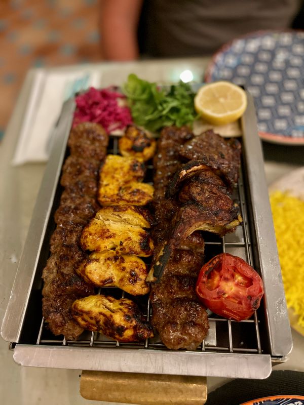 meat bbq on top of griller