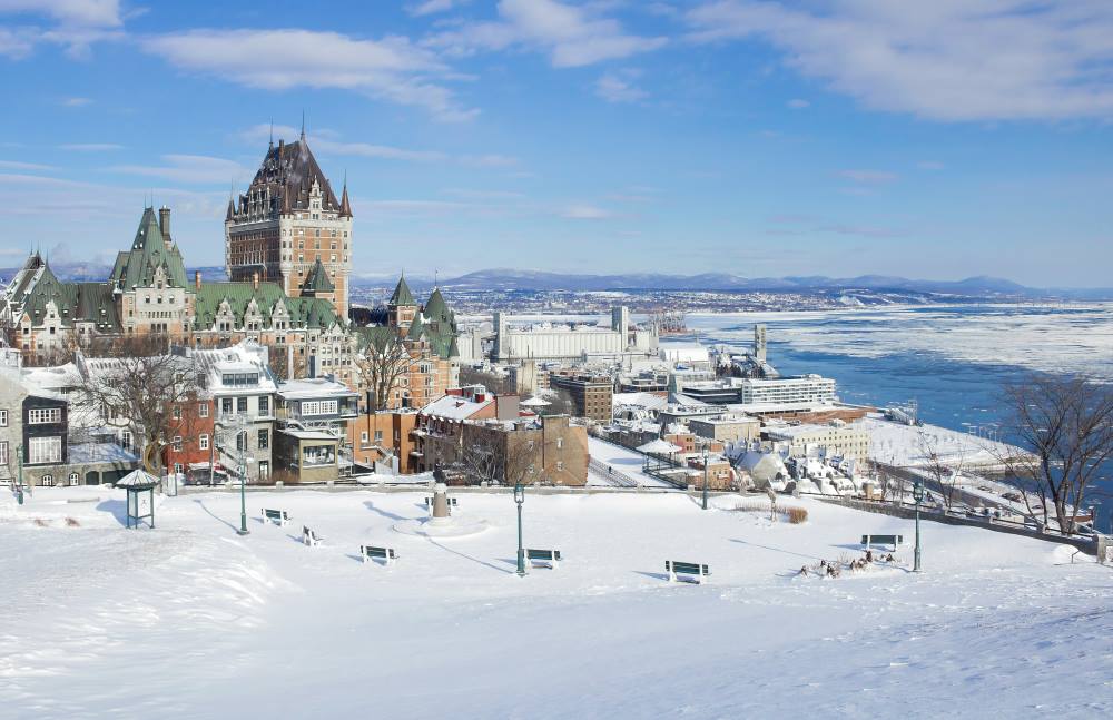 snowy park across are buildings and houses- canada digital nomad visa