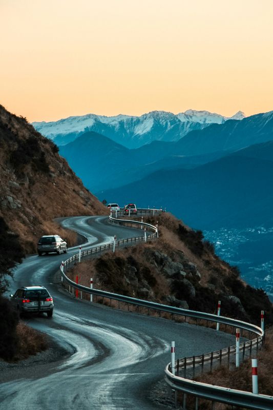 cars driving in a curvy highway