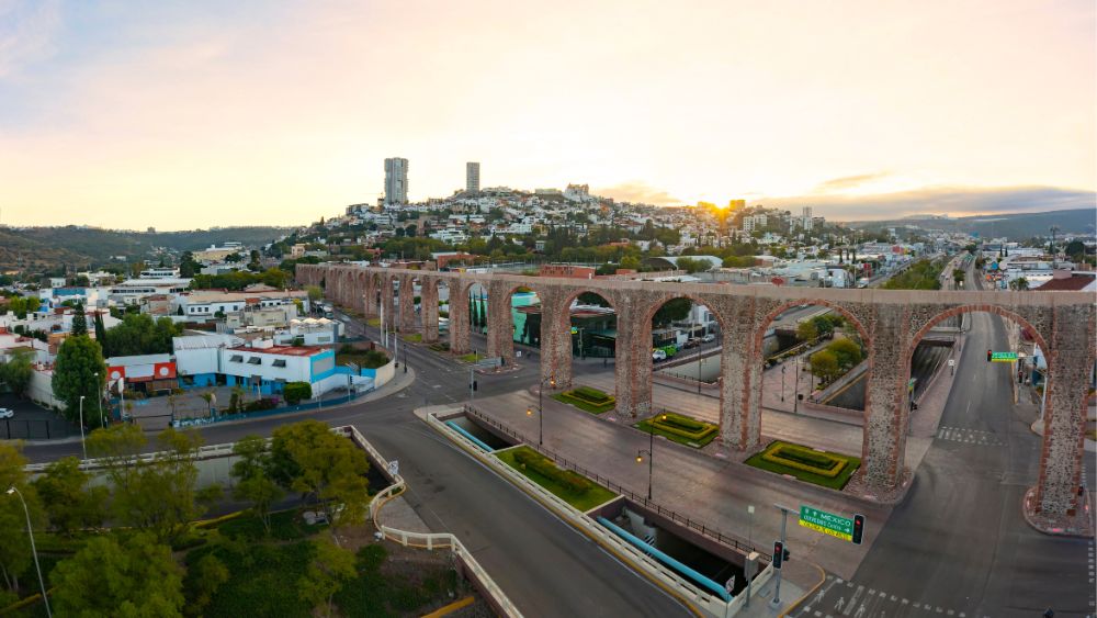 aerial view of the city, showing street with houses and building and tall wall in the middle of the road-25 Best Places to Visit in Mexico