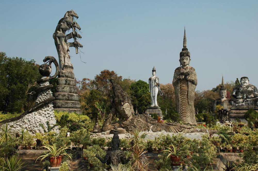 different tall rock statue in the middle of the park - best places to visit in thailand