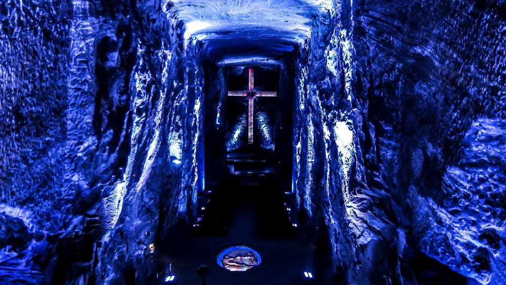 underground The Salt Cathedral  with cross in the middle  in color blue background - Underground Attractions