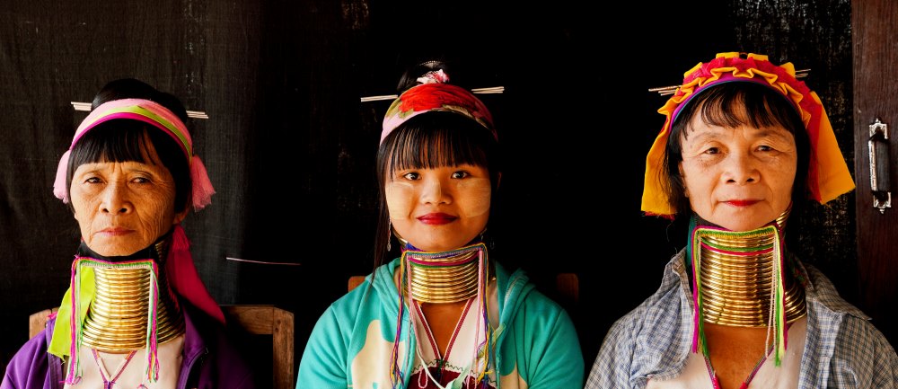 three women with golden big ring in their neck