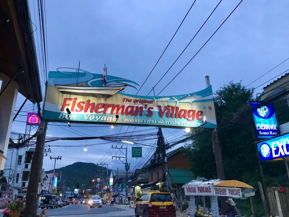 welcome arc of fisherman village in the middle of the road - best places to visit in thailand