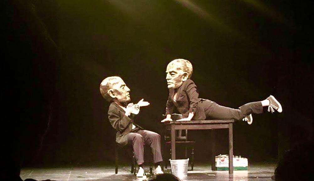 a show featuring two peole with oversized heads during the san francisco international arts festival