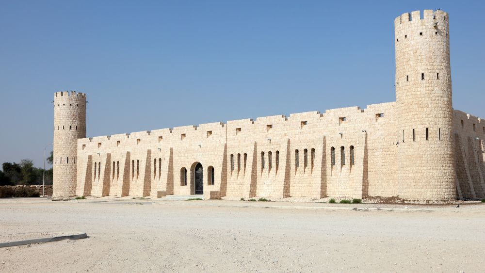 off white castle like building - Things to Do in Doha