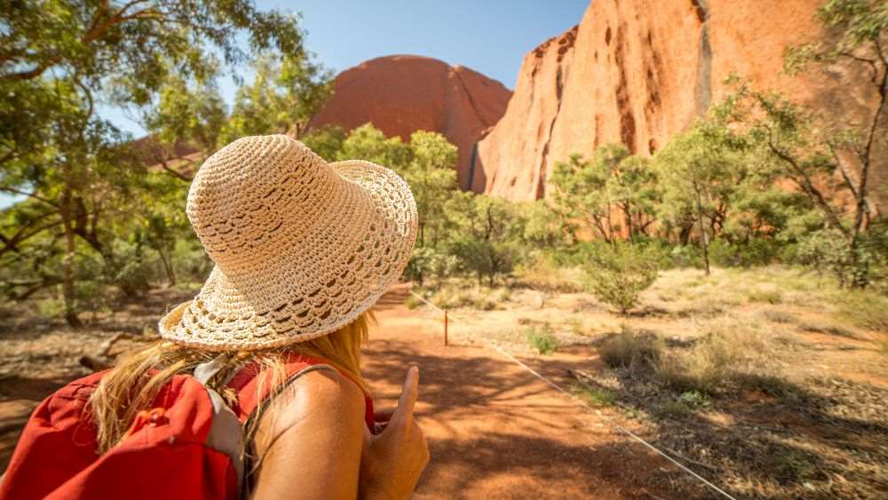 women travelling facing at the mountain