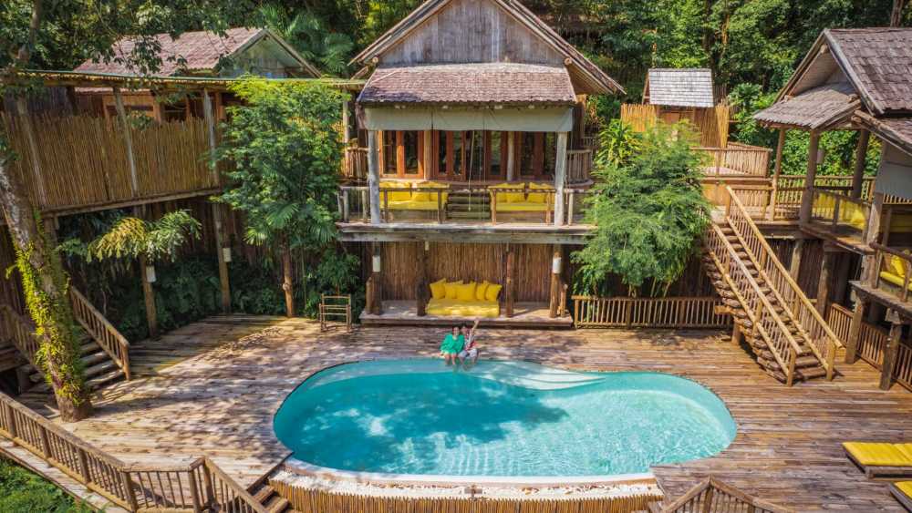 With a view into the beautiful bay, this villa offers a private pool and an open-air bathroom nestled in the jungle.