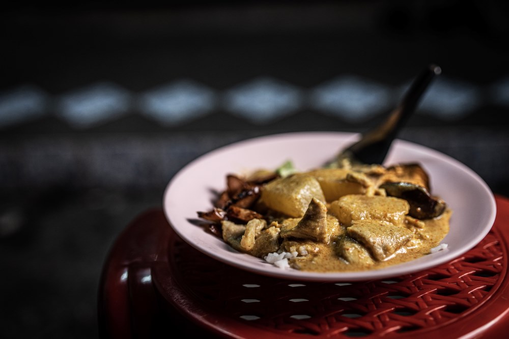 yellow curry on top of a red chair
