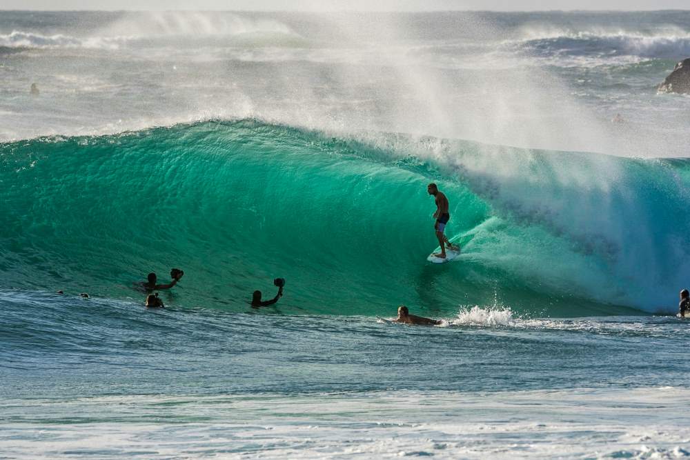 people surfing with big waves