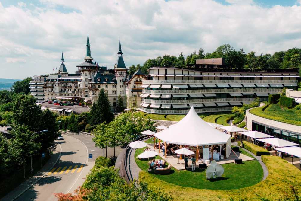 hotel building surrounded by trees and plants
