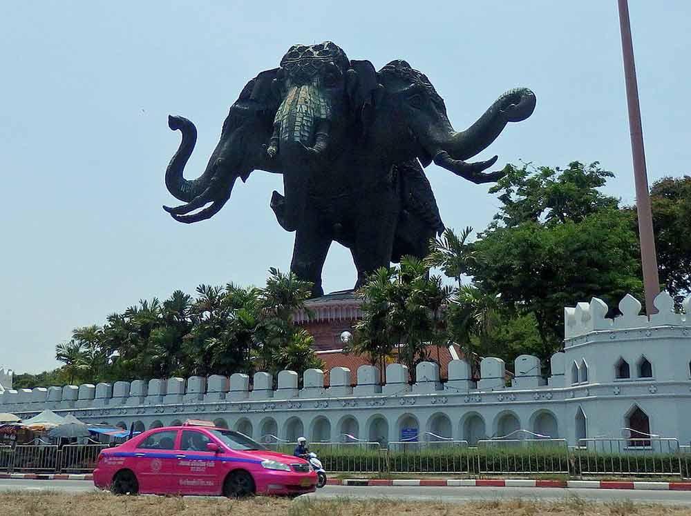 huge headed elephant statue on top of a building