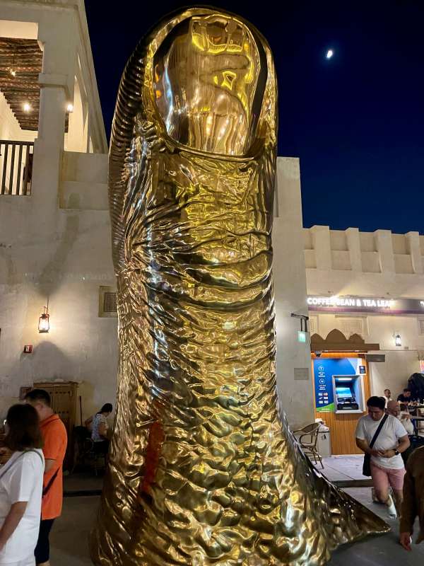 giant golden thumb statue