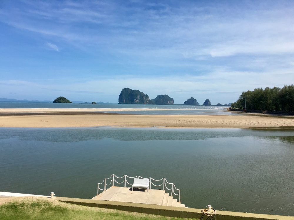 ocean view with trees on the side and rock formation - best places to visit in thailand
