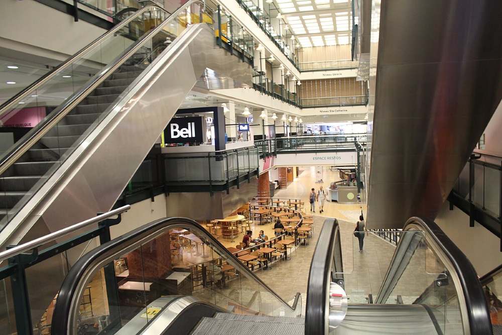 escalator with shopping malls and restaurants
