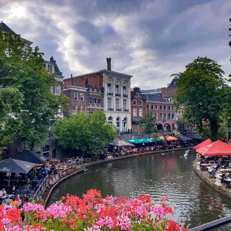 outdoor cafes on both side of the canal- netherlands digital nomad visa