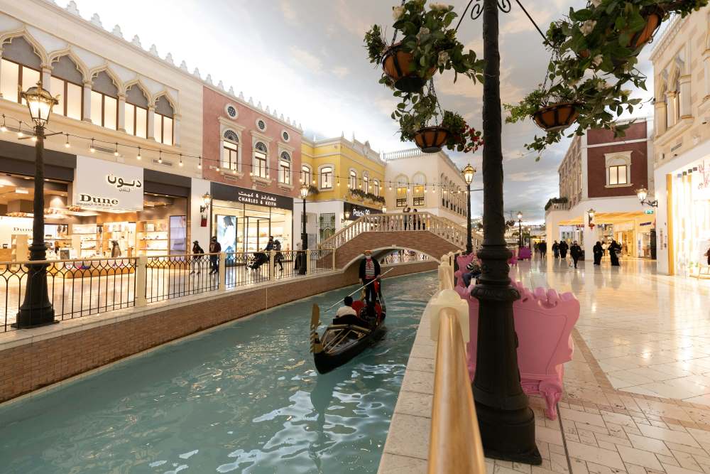 gondola in the middle of a canal inside shopping mall