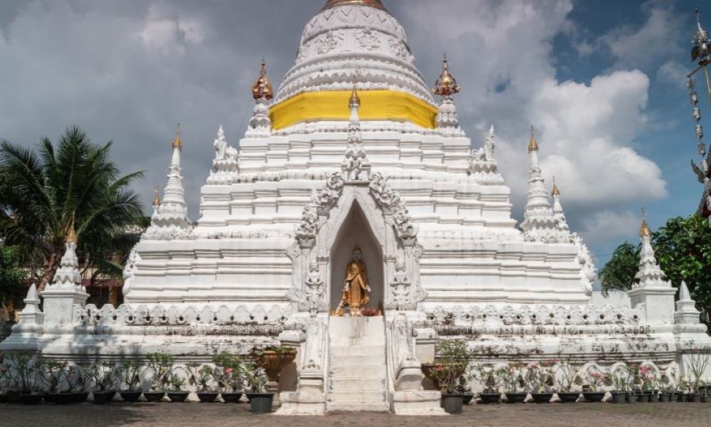 statue in the middle of a white temple- chiang mai temples
