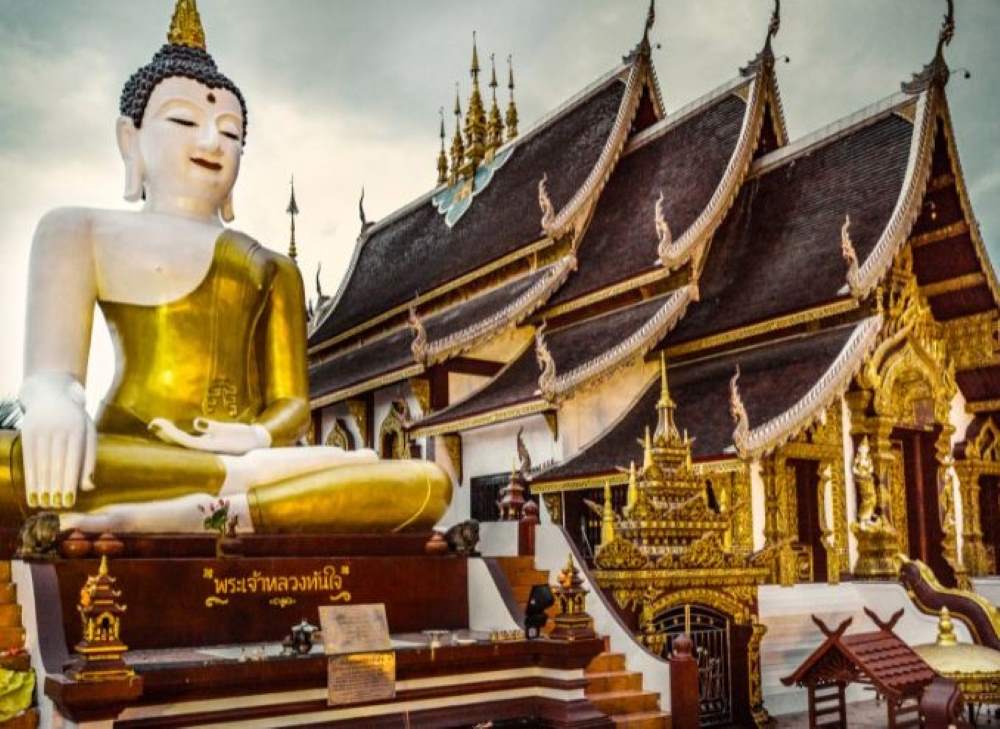 big white and gold statue near temple- chiang mai temples