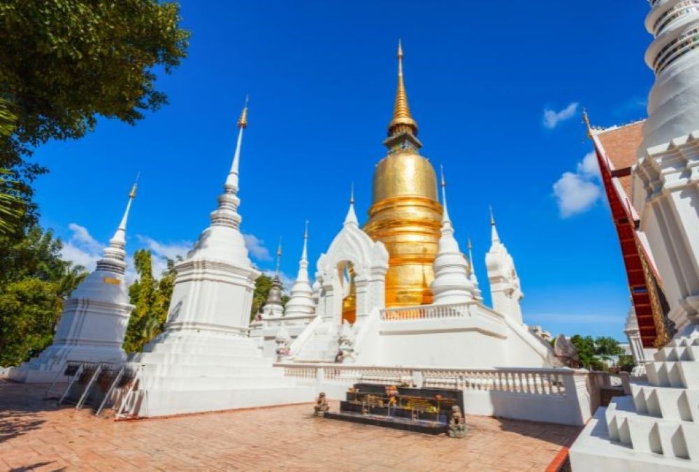 white structures with gold structure in the middle - chiang mai temples