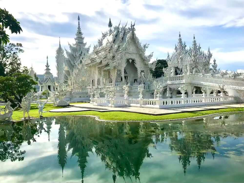 white concrete temple like beside body of water- thailand digital nomad visa