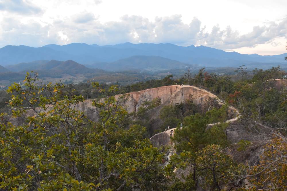 brown mountain surrounded by green trees - thailand digital nomad visa