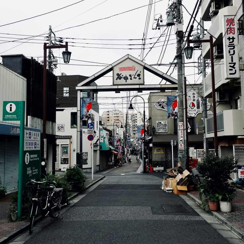 empty narrow street with signage - best things to do in Tokyo -