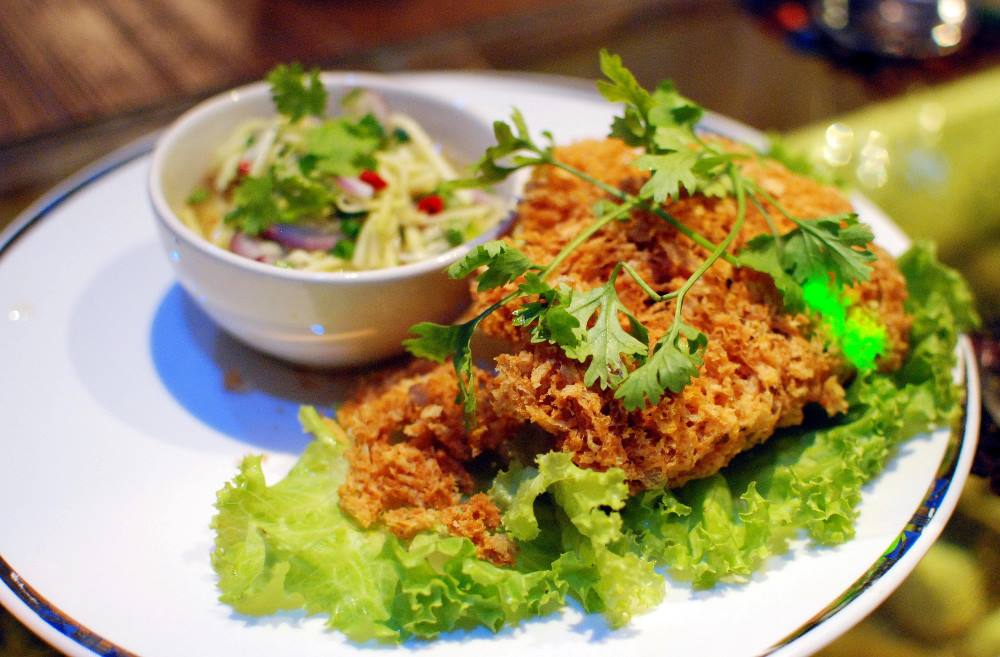 fried and crispy Catfish, green mango, and a medley of herbs and spices.